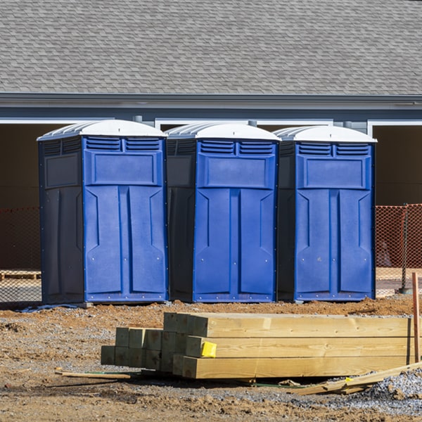 what is the cost difference between standard and deluxe portable toilet rentals in Huston